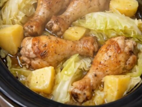 Slow cooker chicken drumsticks served over a bed of tender cabbage wedges and baby yellow potatoes.