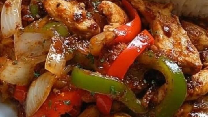 A beautifully arranged dinner plate featuring a neat dome of white rice, golden crispy fries, and glossy chicken stir-fry.