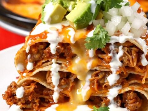 A tall, beautiful wedge of Pork Al Pastor Taco Lasagna showing distinct layers of pork, pineapple, and melted cheese.