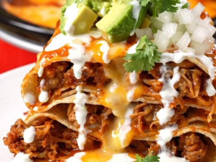 A tall, beautiful wedge of Pork Al Pastor Taco Lasagna showing distinct layers of pork, pineapple, and melted cheese.