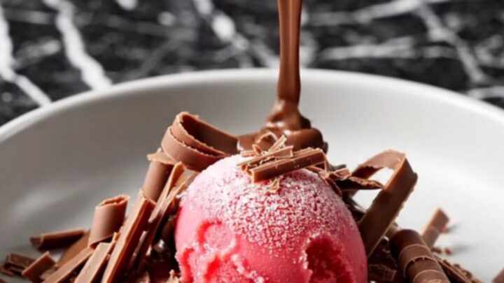 A decadent triple chocolate crockpot volcano cake with a molten ganache center served in a dark bowl.