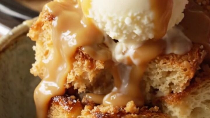 A close-up view of the slow-cooker bread pudding with caramel sauce and pretzels.