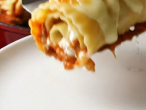 Skillet lasagna roll-ups with melted mozzarella and basil