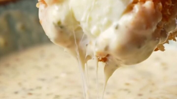 Golden crispy potato croquettes with a cheesy pull, served with ranch dip