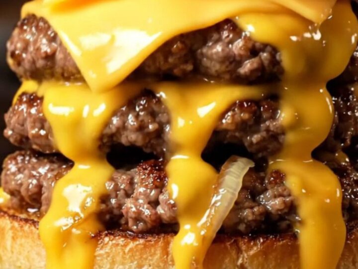 Cross-section of an Oklahoma onion smash burger with molten American cheese