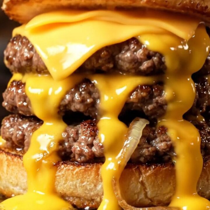 Cross-section of an Oklahoma onion smash burger with molten American cheese