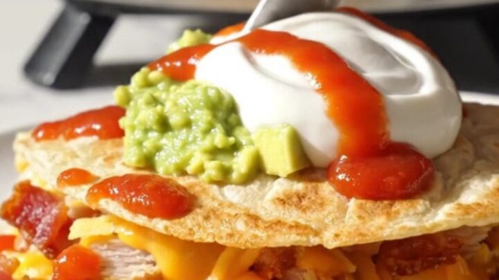 Golden waffle-iron quesadilla triangle with deep crispy pockets of melted cheddar and bacon