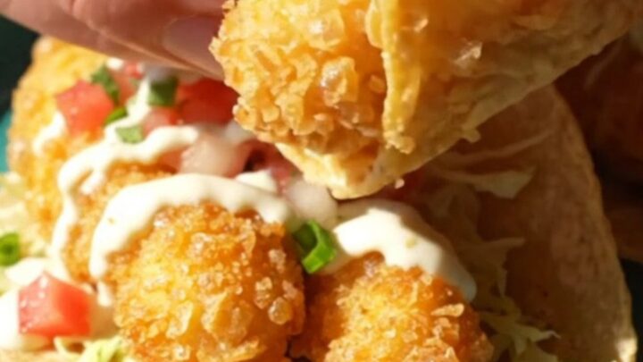 Beer-battered Baja fish tacos on corn tortillas with cabbage, pico de gallo, and white garlic-lime sauce