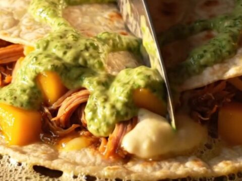 Golden blistered quesadilla wedges stretching molten pepper jack over chipotle pork and glossy mango cubes
