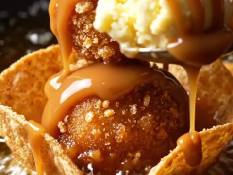 Churro-crusted fried ice cream ball in a crispy cinnamon tortilla bowl with hot fudge, caramel and whipped cream