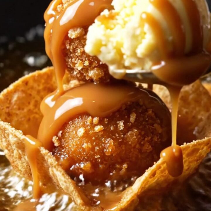 Churro-crusted fried ice cream ball in a crispy cinnamon tortilla bowl with hot fudge, caramel and whipped cream