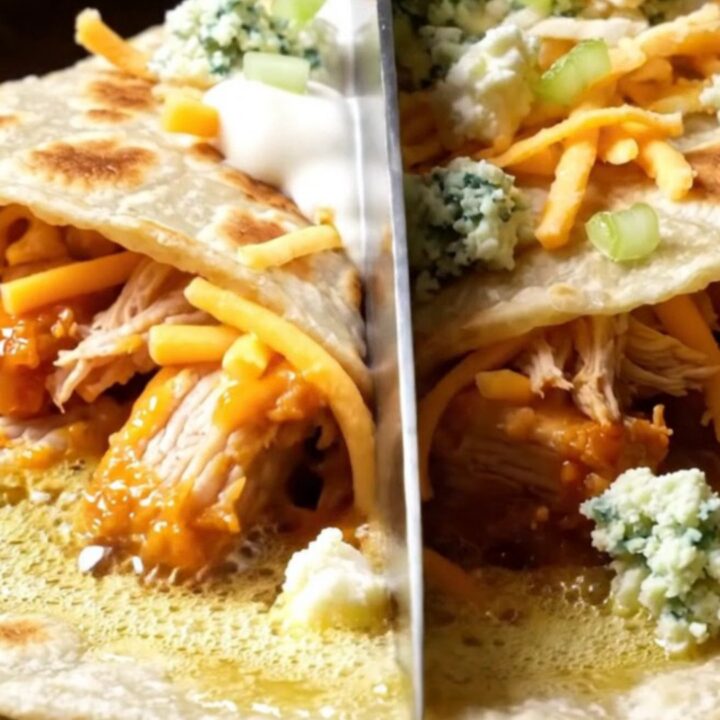 Golden buffalo chicken quesadilla wedge with a long stretch of melted mozzarella and cheddar, drizzled with ranch