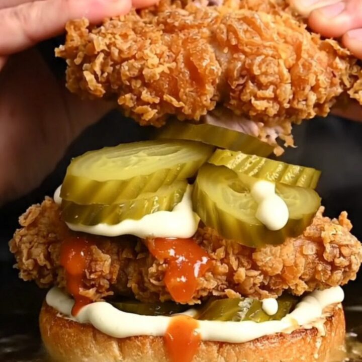 Crispy buttermilk fried chicken sandwich on a brioche bun with pickles and spicy mayo