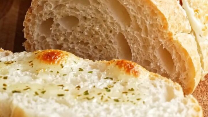 Golden stuffed garlic bread with cheese pull and Cajun chicken