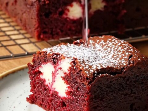 Red velvet cheesecake brownies with a fudgy crumb and white cream cheese swirl