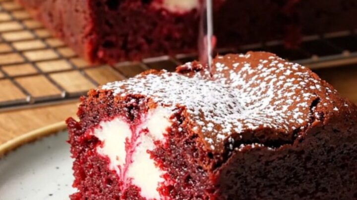 Red velvet cheesecake brownies with a fudgy crumb and white cream cheese swirl