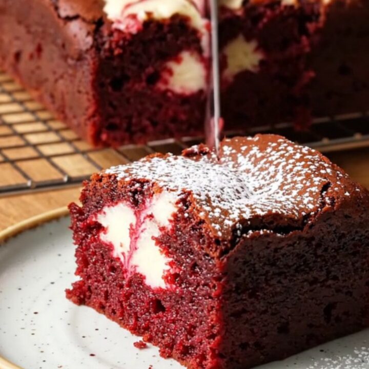 Red velvet cheesecake brownies with a fudgy crumb and white cream cheese swirl