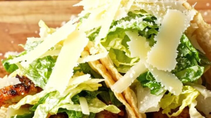 Crispy Chicken Caesar Smash Tacos piled with Caesar salad and shaved parmesan