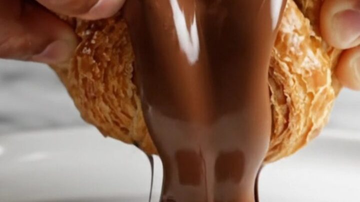 Golden braided puff pastry with melted chocolate oozing out