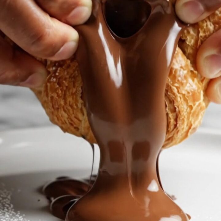Golden braided puff pastry with melted chocolate oozing out