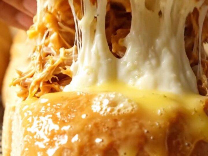 Golden pull-apart rolls with melted mozzarella stretching between them