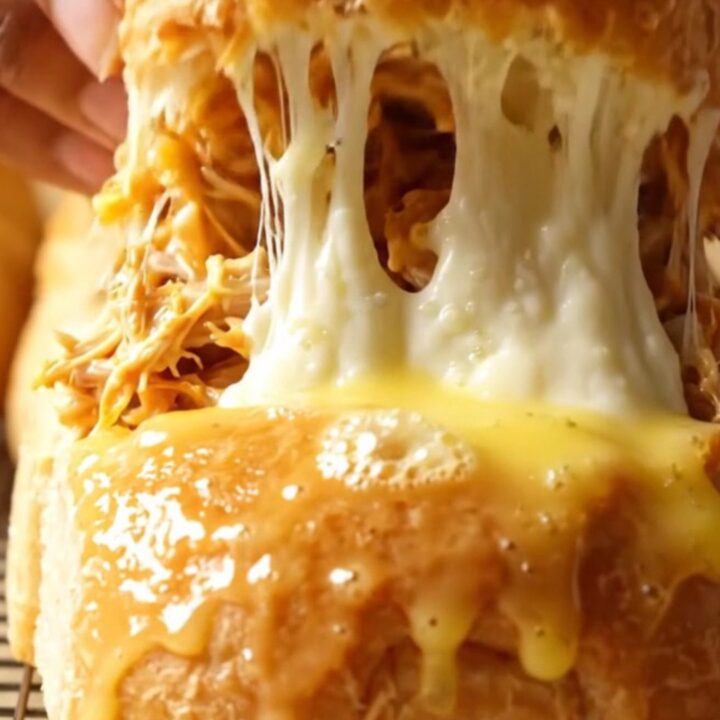 Golden pull-apart rolls with melted mozzarella stretching between them