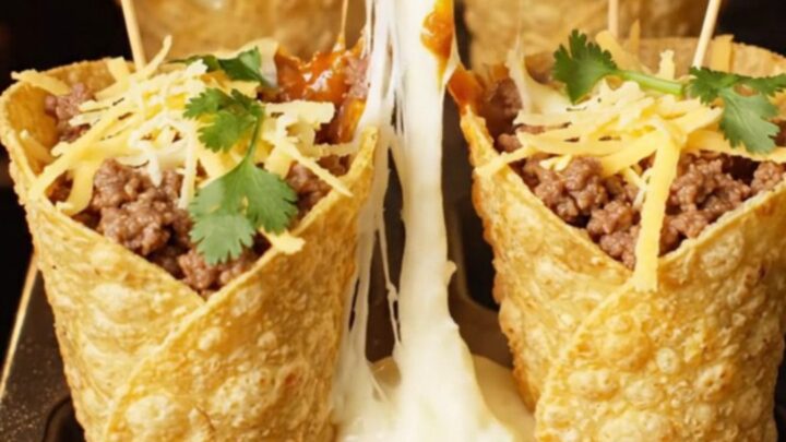 Crispy tortilla cone filled with ground beef and melted mozzarella, cheese pulling as it is lifted