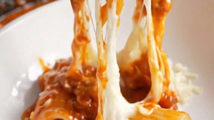 One-pan mini meatballs and shell pasta in a skillet with melted mozzarella