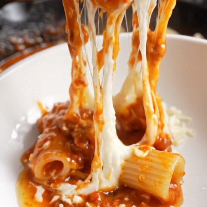 One-pan mini meatballs and shell pasta in a skillet with melted mozzarella