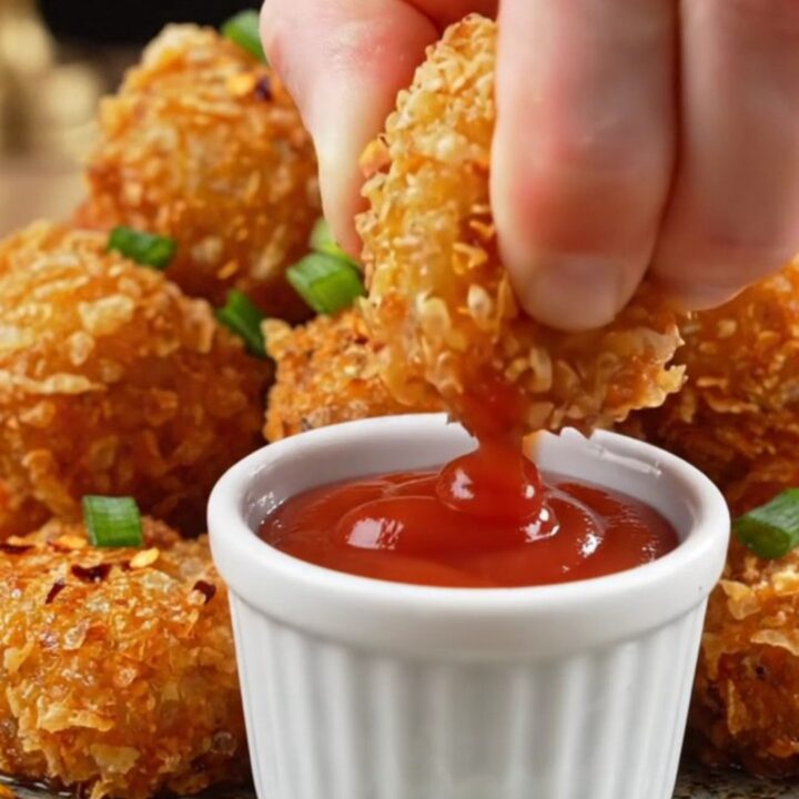 Golden crispy potato nuggets with a shatteringly crunchy crust, served with ketchup