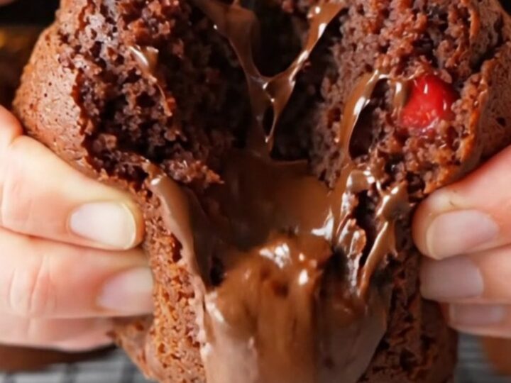 Double chocolate strawberry banana muffins with melted chocolate and berry pieces on a cooling rack