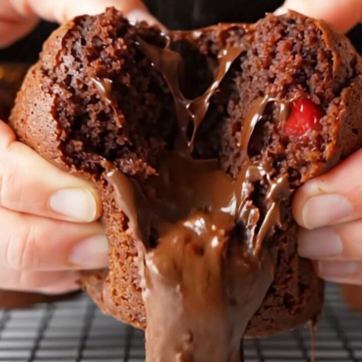 Double chocolate strawberry banana muffins with melted chocolate and berry pieces on a cooling rack