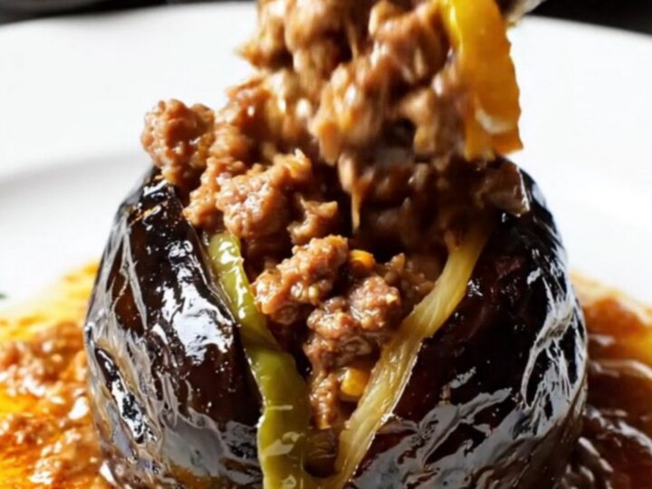 Golden baked Turkish stuffed eggplants with spiced beef filling and tomato sauce