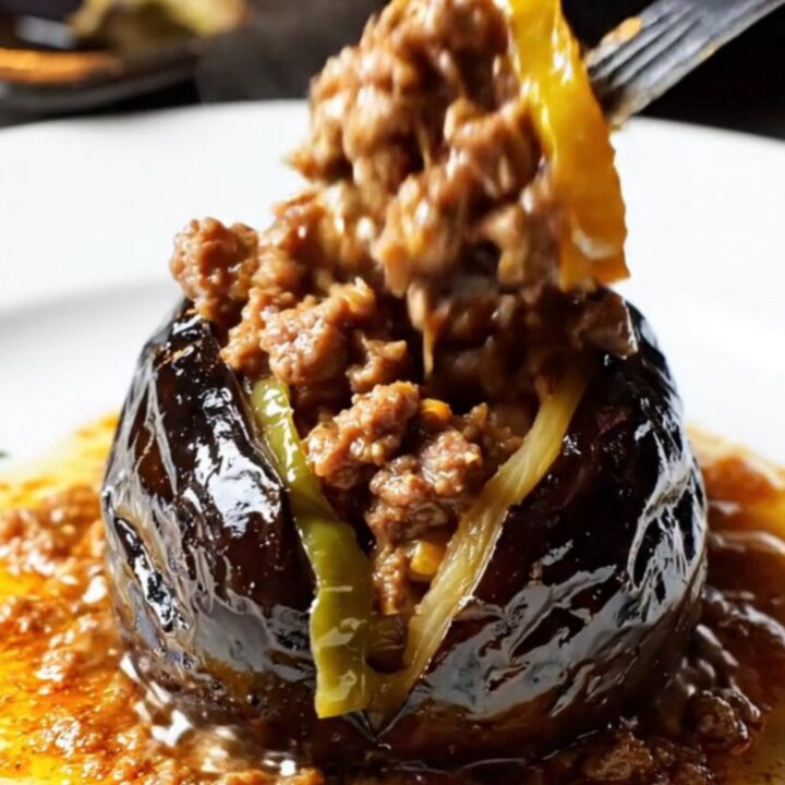 Golden baked Turkish stuffed eggplants with spiced beef filling and tomato sauce