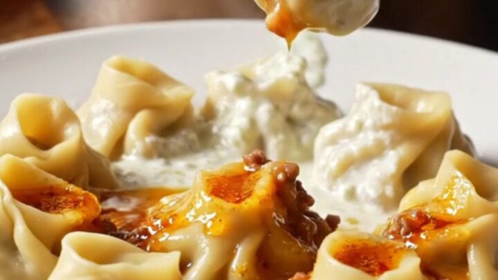 Plated Turkish dumplings with garlic yogurt and red pepper butter