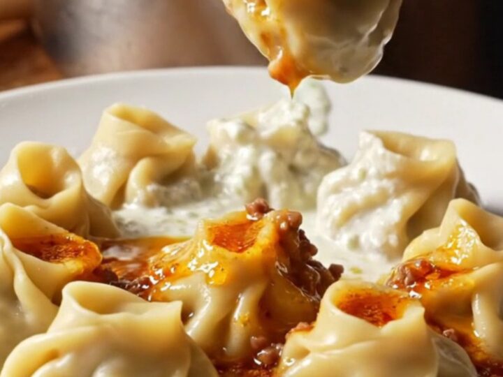 Plated Turkish dumplings with garlic yogurt and red pepper butter