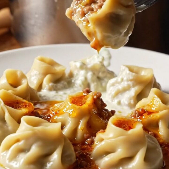 Plated Turkish dumplings with garlic yogurt and red pepper butter