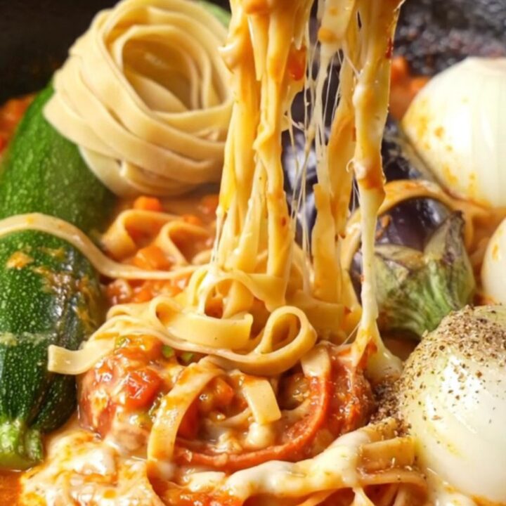 One-skillet tagliatelle with whole vegetables, topped with melted cheese and parsley