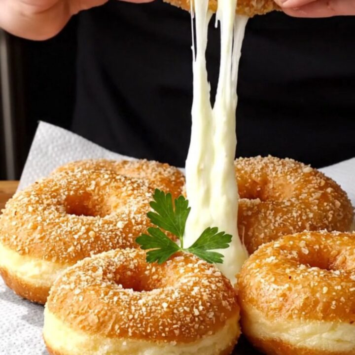 Golden crispy chicken and potato doughnuts with melted cheese pull