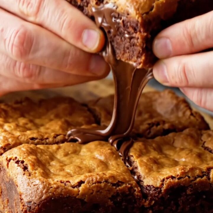 Golden brown butter chocolate chip blondies cut into squares with melted chocolate chips visible