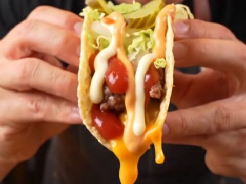 Big Mac Smash Burger Tacos topped with lettuce, pickles, and secret sauce on a plate.