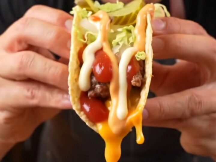 Big Mac Smash Burger Tacos topped with lettuce, pickles, and secret sauce on a plate.