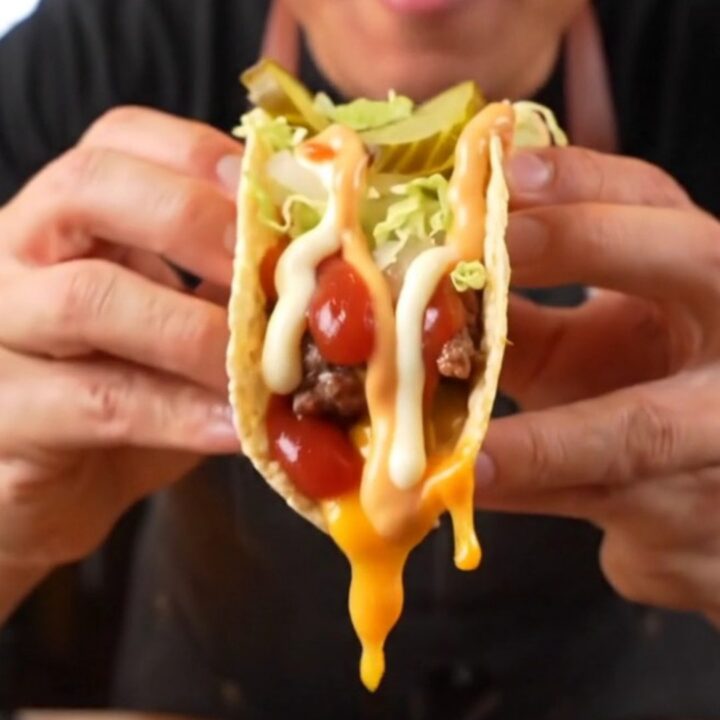 Big Mac Smash Burger Tacos topped with lettuce, pickles, and secret sauce on a plate.