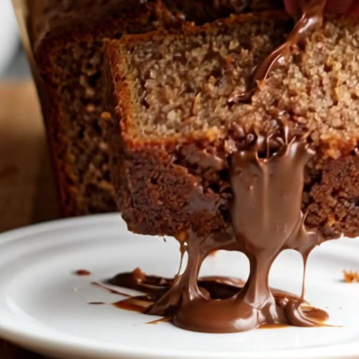 Sliced ultra-moist chocolate chip banana bread showing tender crumb and melted chocolate