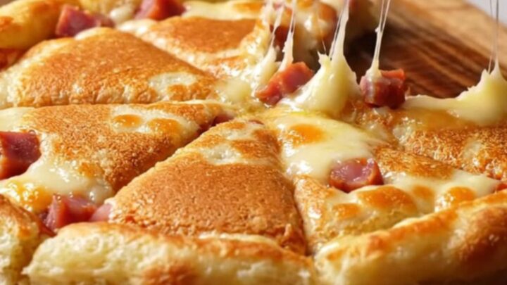 Golden sucuk and kashar pancake wedges on a wooden board, with melted cheese and crispy edges
