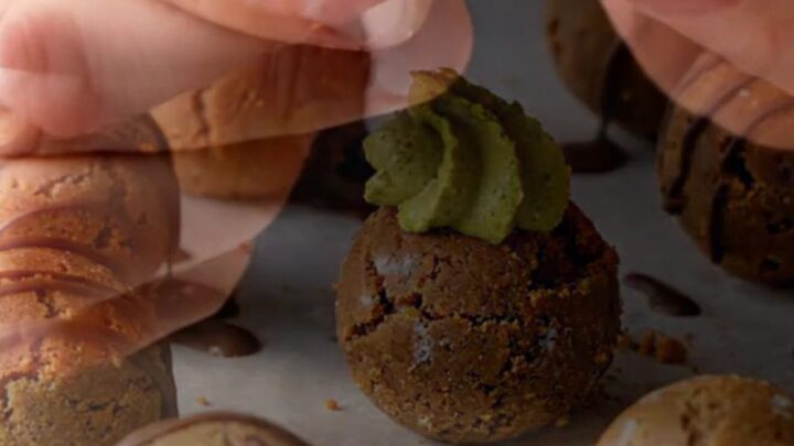 Decadent no-bake biscuit cookies with pistachio cream center and chocolate drizzle