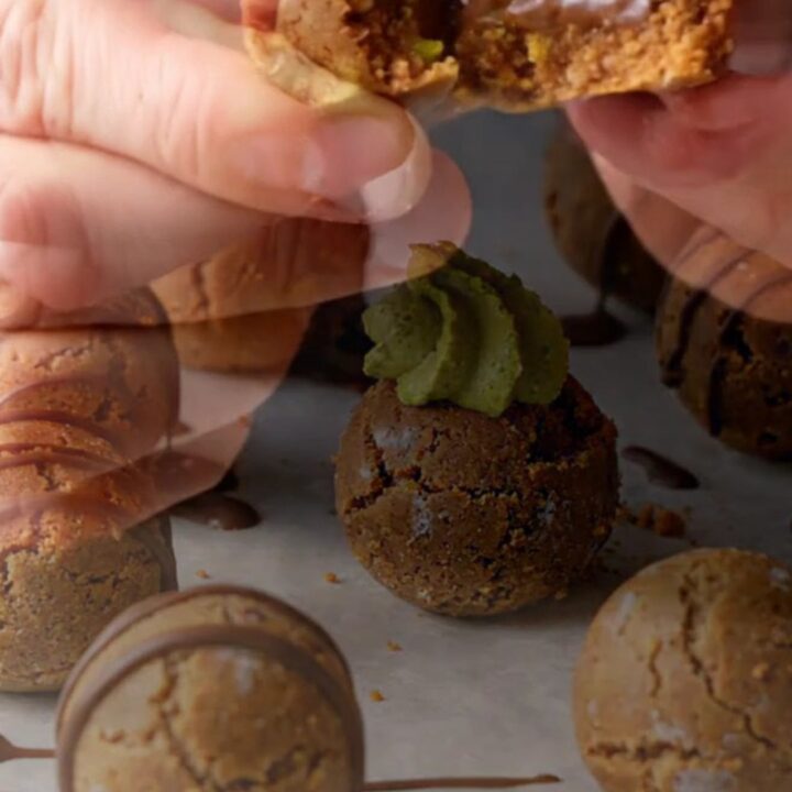 Decadent no-bake biscuit cookies with pistachio cream center and chocolate drizzle