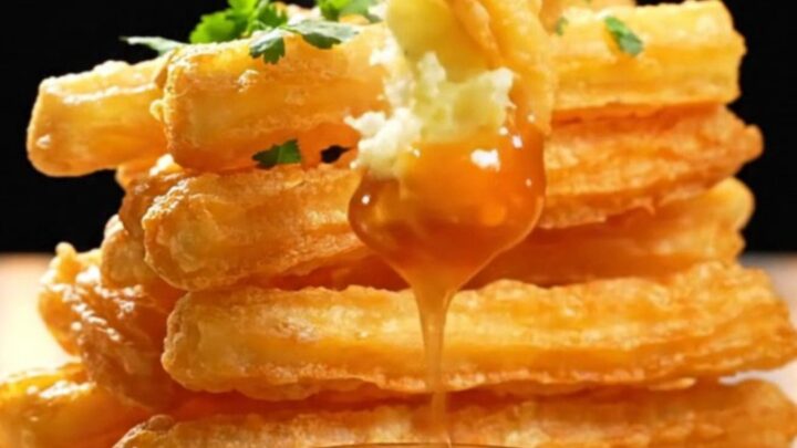 Twisted crispy potato churro fries served with sweet chili sauce on a white plate