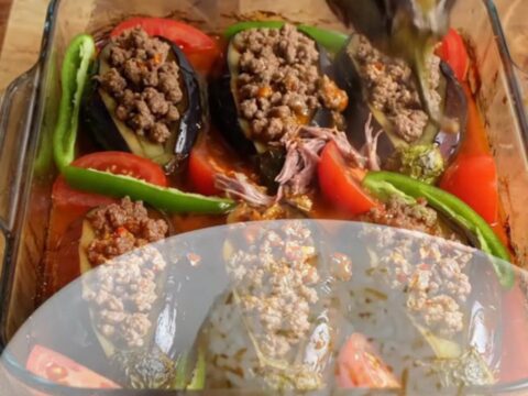 Accordion eggplant kebab casserole with spiced beef and tomato sauce, baked and topped with fresh herbs.