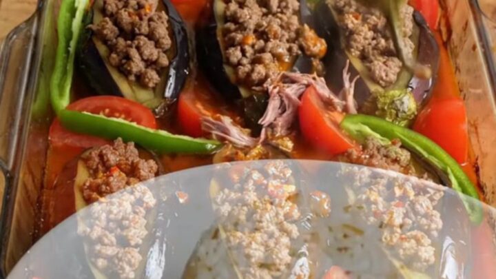 Accordion eggplant kebab casserole with spiced beef and tomato sauce, baked and topped with fresh herbs.